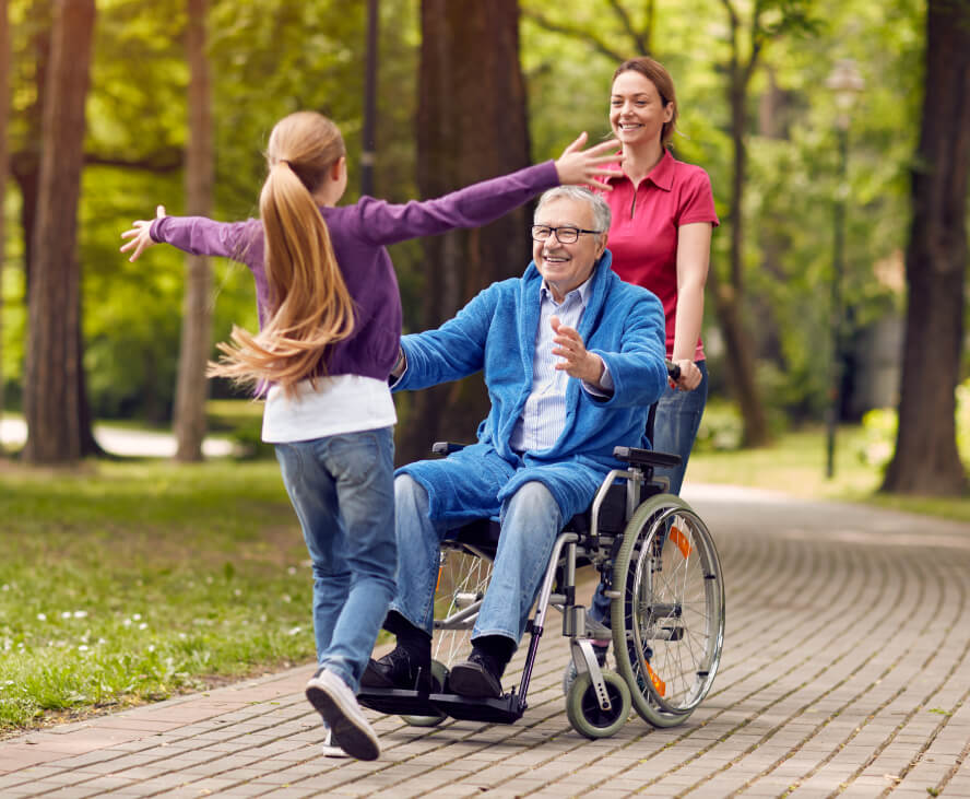 senior man in wheelchair with granddaughter