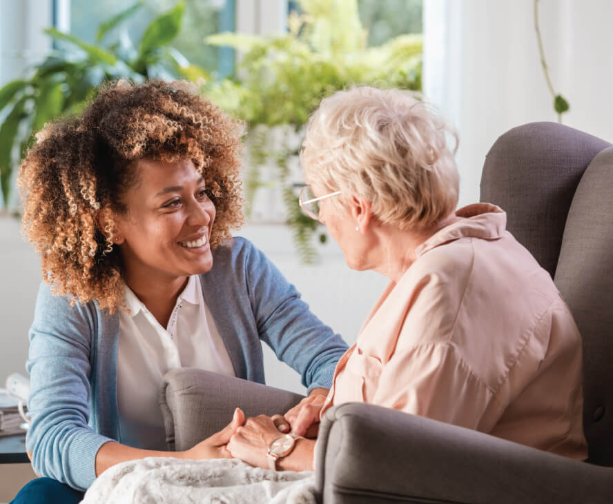 woman helping senior woman