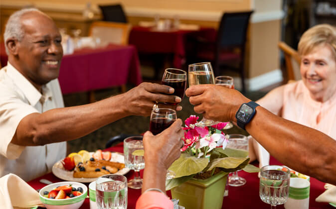 residents cheersing their glasses