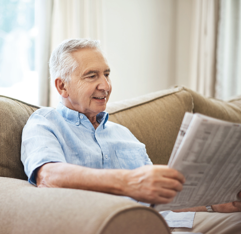 senior man reading newspaper