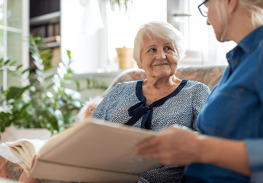 Senior listening to a family member read